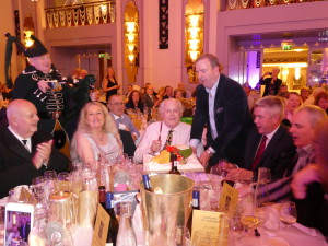 Duncan Spence (with his partner Amy McKee to his left) presented with a birthday cake that made reference to Rickety Bridge, his South African vineyard.