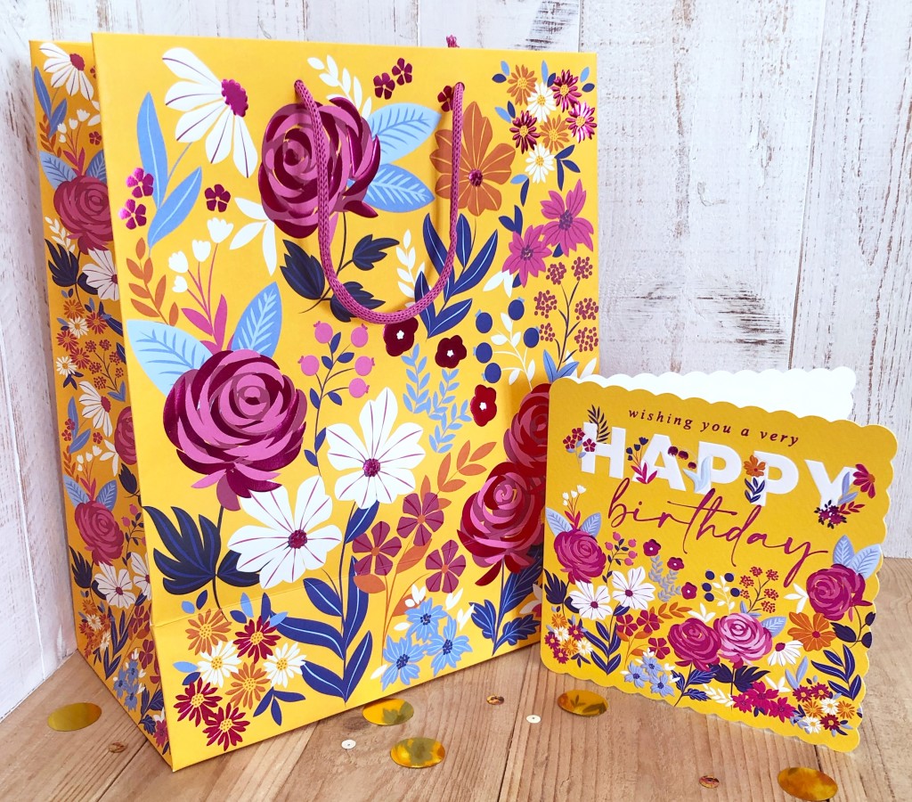Above: The bright floral card has translated well on to bags