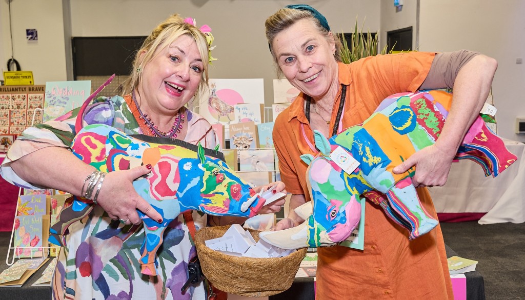 Above: PG’s Jakki Brown leant a hand to the business card draw on Kirsty Todd Illustrations’ stand for the sculpture of a rhino made from discarded flip flops in Kenya, which was delivered today, 13 June, to winner Presentimes in Faversham