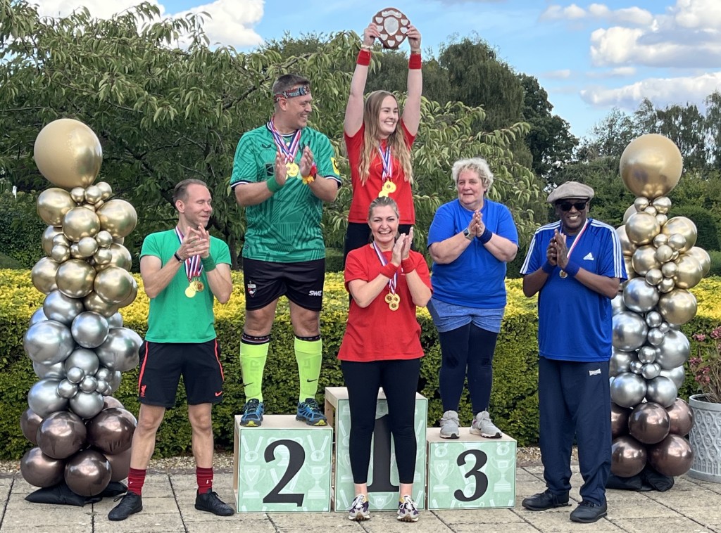 Above: Team captains on the podium, Windles’ Casey Wallington and Sarah Clements, Woodies’ Rob Keen and Ryan Kershaw, and Wickies’ Nigel Babb and Carol Ford