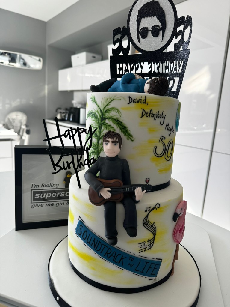 Above: David Robertson’s recent 50th birthday cake was testament to his Oasis persuasion