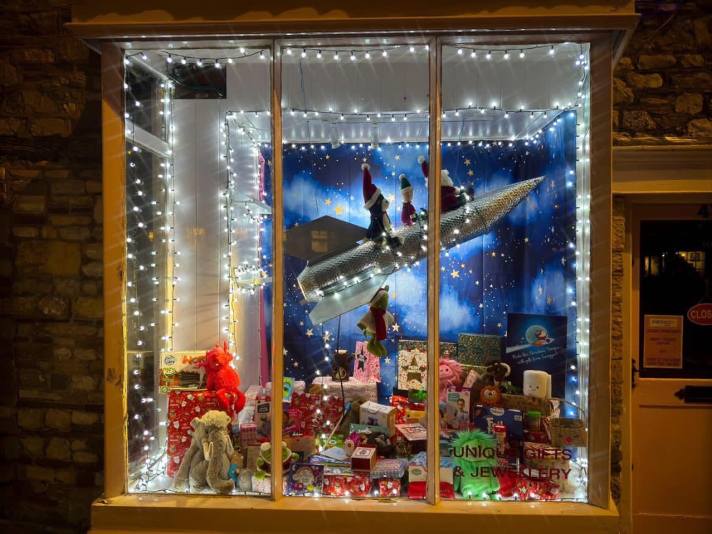 Above: The display at Swagger Gifts in Chipping Sodbury is out of this world as Father Christmas enjoys a rocket ride to the Moon with his elf and Jellycat