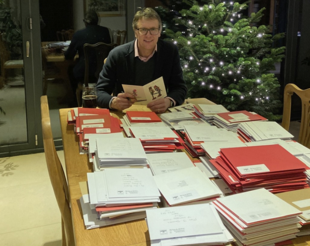 Above: As long-time Festive Friday supporters Nigel had a busy couple of days at home sticking stamps on over 1,000 cards the retailer’s team wrote last Christmas